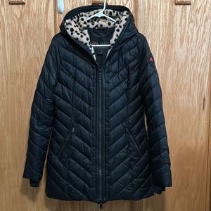 Pajar Canada women’s hooded, quilted winter jacket with faux fur trim.